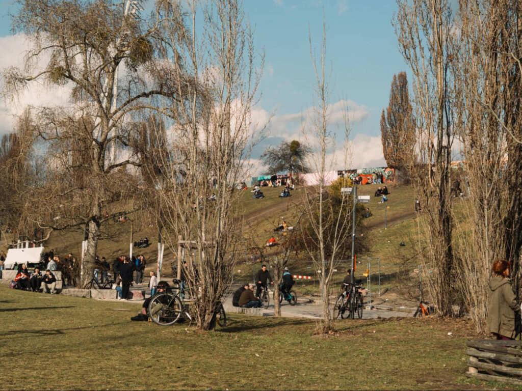 View of the people chilling beneath the Wall in Mauerpark