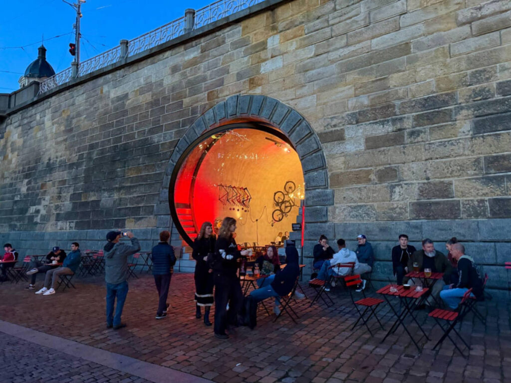 People drinking at the riverside bar of LAb