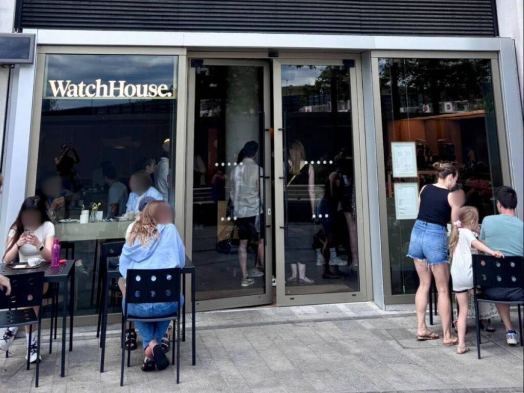 View of the busy inside and the people enjoying outside at WatchHouse.