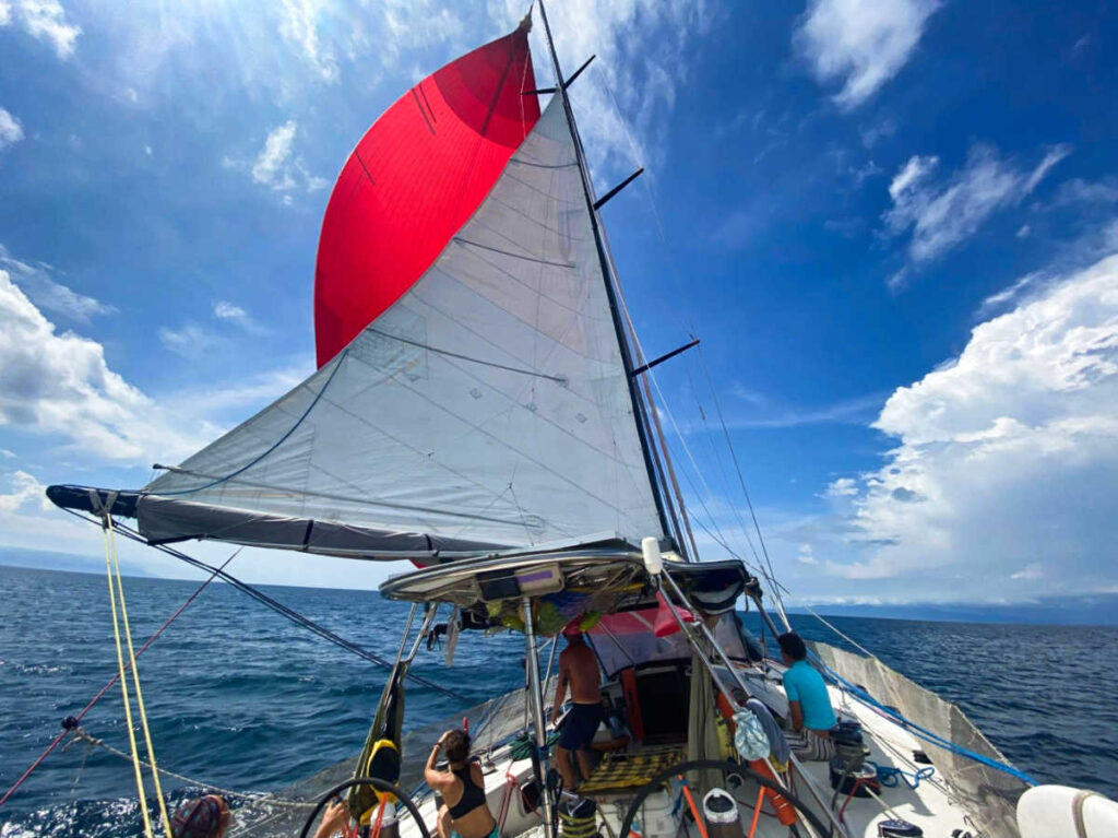 The crew putting the gennaker while sailing