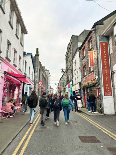 People walking along the city center of Galway