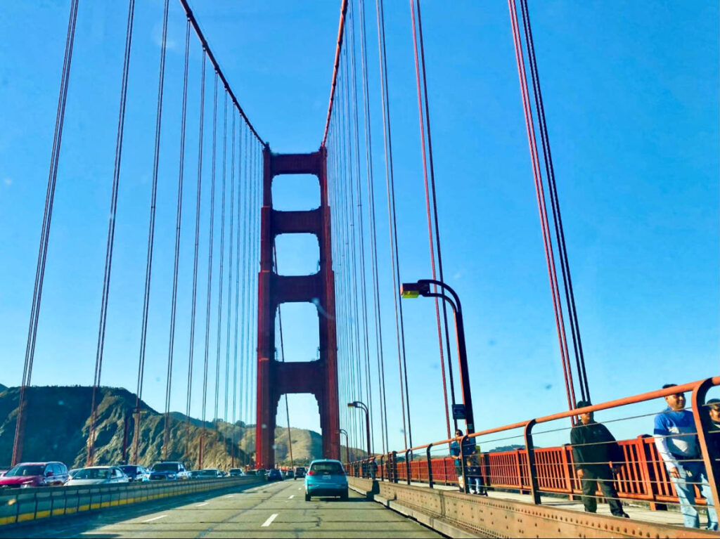 People walking on the side of Golden Gate Bridge