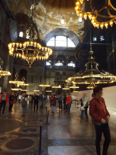 View of people and chandeliers inside Hagia Sophia