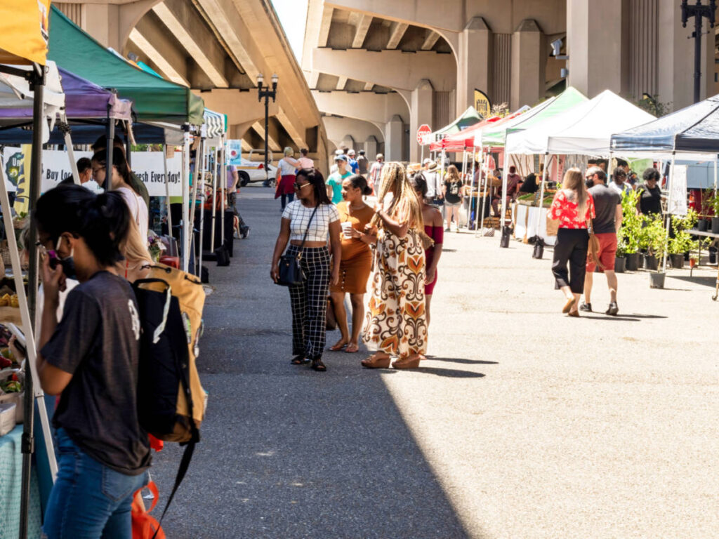 View of the people wandering around the stalls at The Riverside Arts Market