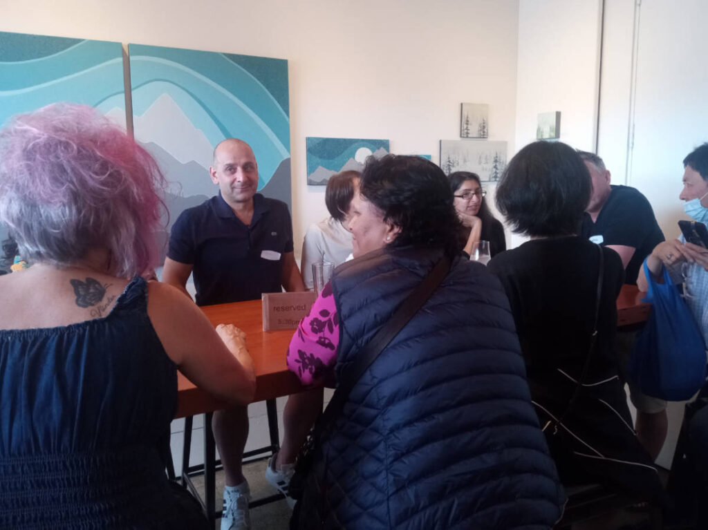 People sharing travel stories during the Vancouver Community Meetup