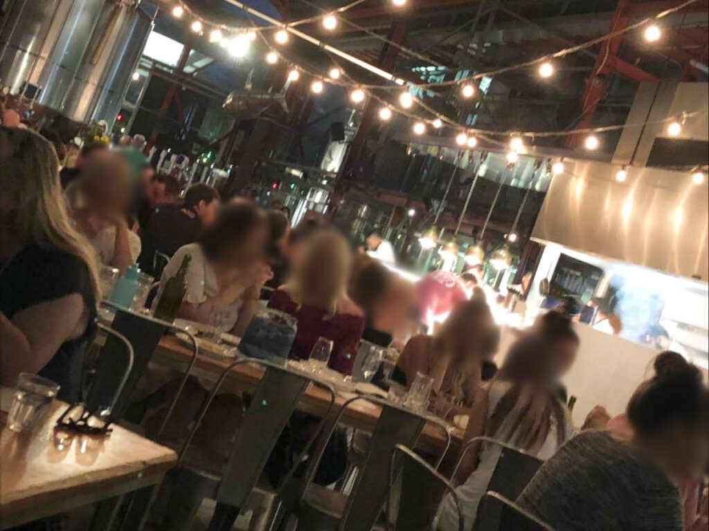 People enjoying inside the Little Creatures Brewery