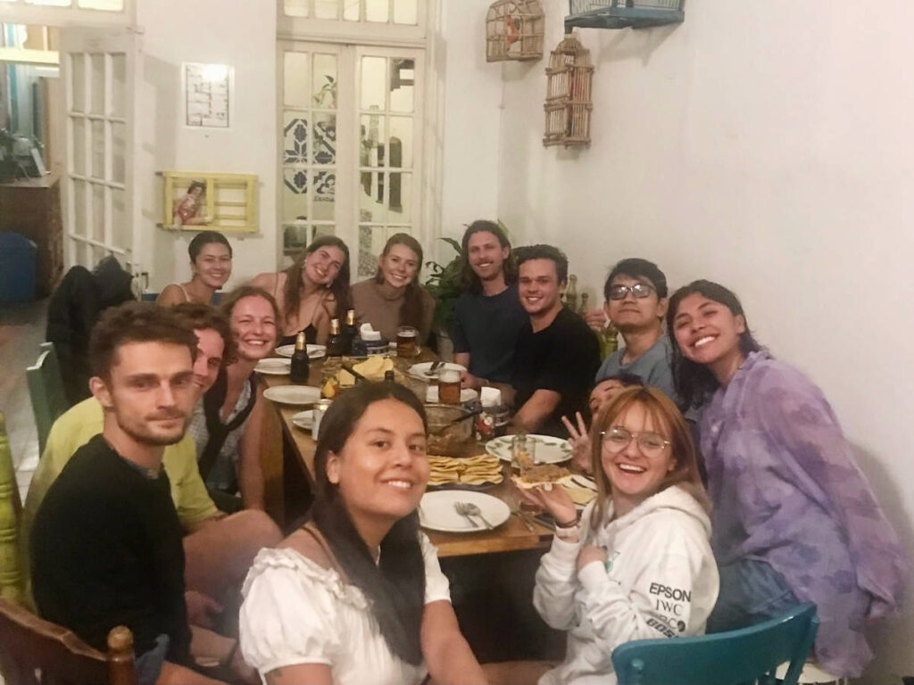 The author, Laura McFarland with some other people hanging out on a hostel