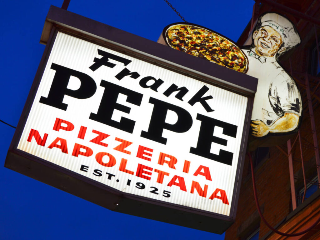 Closeup view of the signage of Pepe’s Pizza at night
