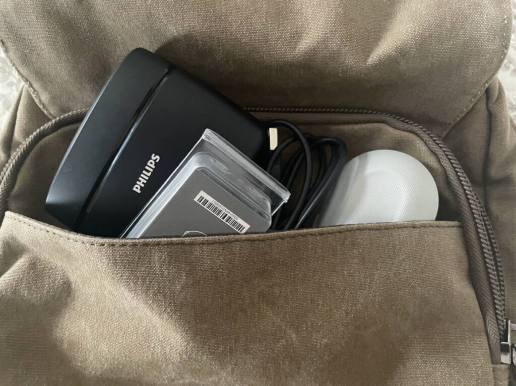 The author's hearing aid and supplies on her carry-on