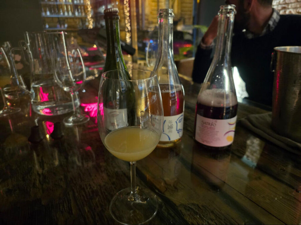 Glasses and Pet-nat wines from Kakheti on a table
