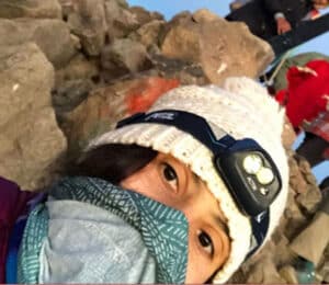 The author taking a selfie while wearing her headlamp