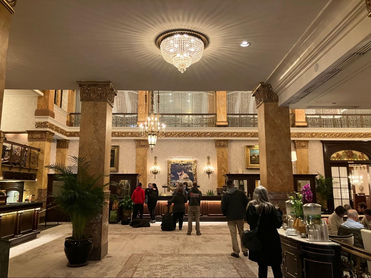 People checking in at the Pfister hotel lobby