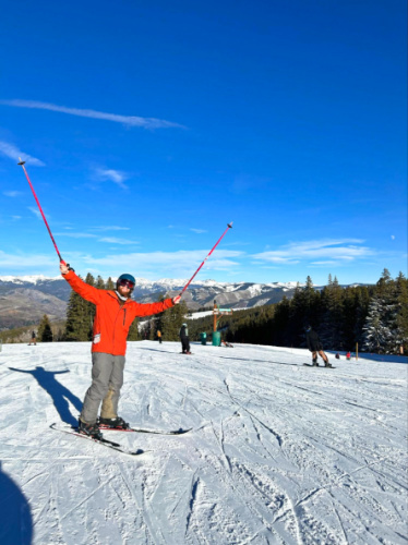 The author Abigail Bliss's husband, posing with the mountain views in the background at Beaver Creek Resort