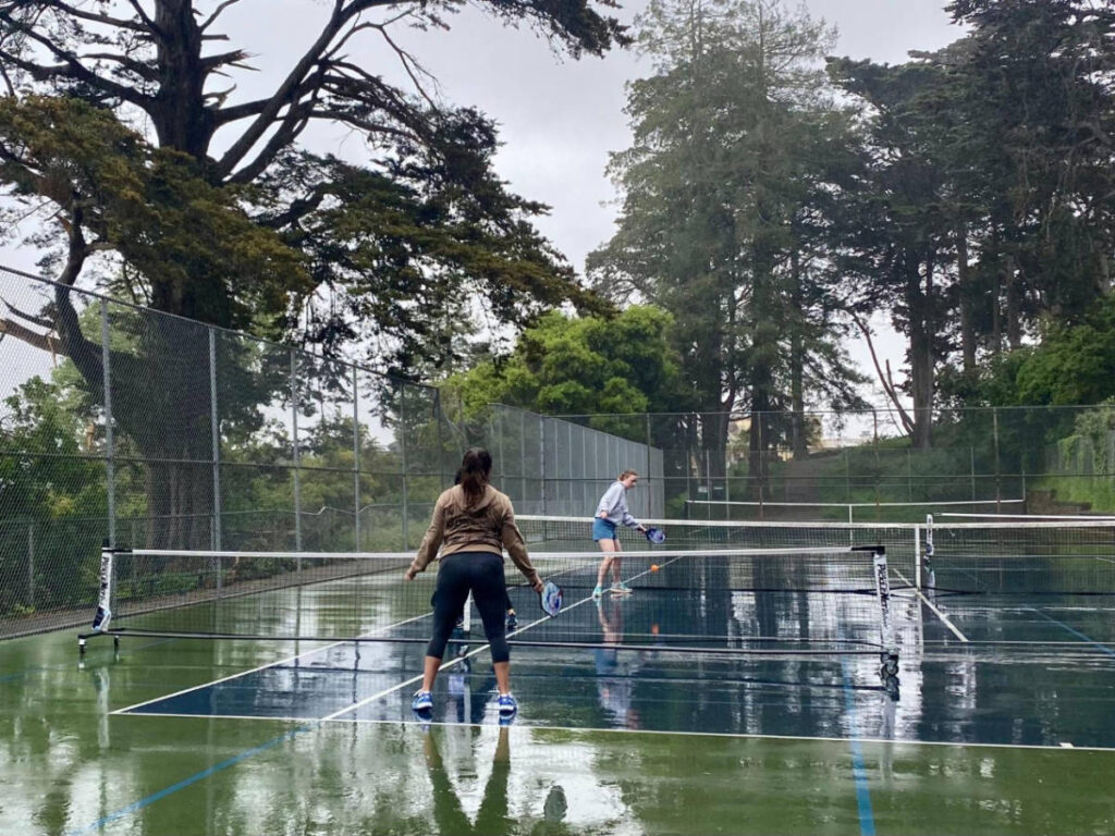 People playing pickleball during a rainy day in Buena Vista Park