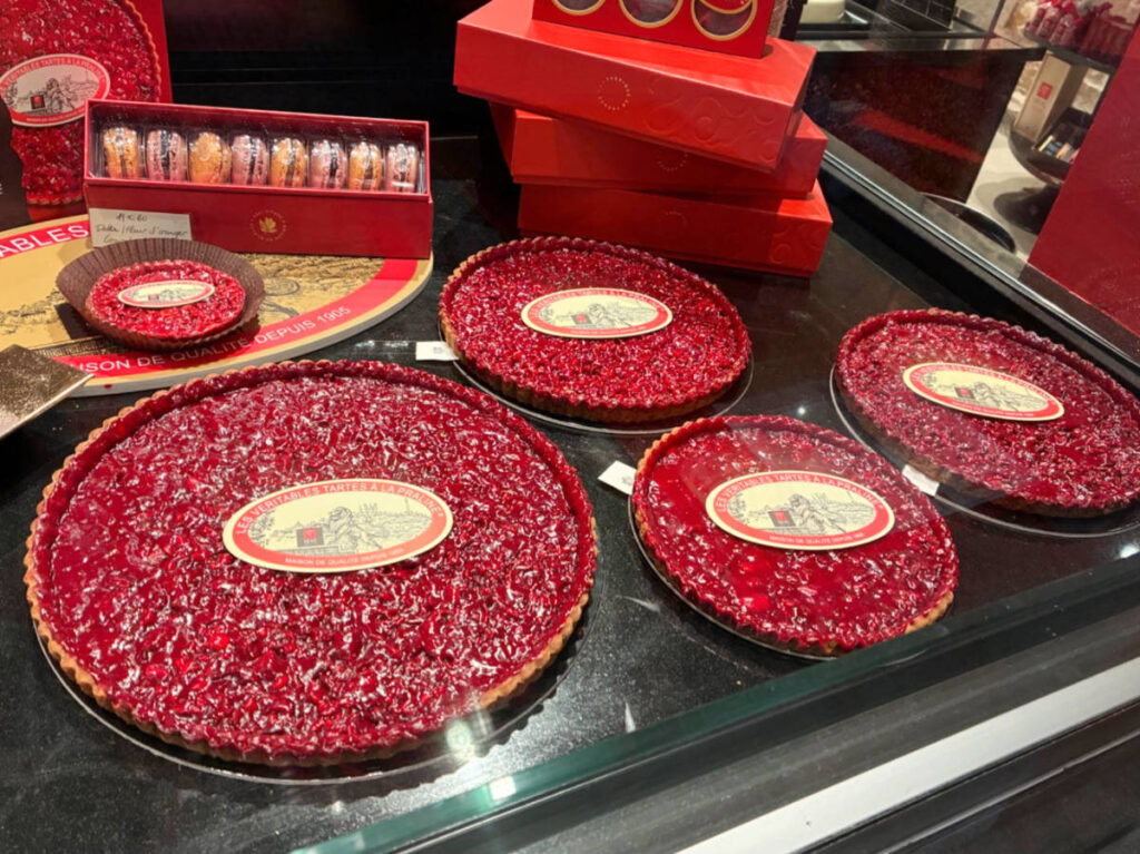 Pink Praline tarts displayed on a store