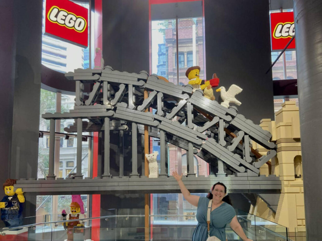 The author Ann-Marie Cahill, posing for a photo at the Pitt Street LEGO Store
