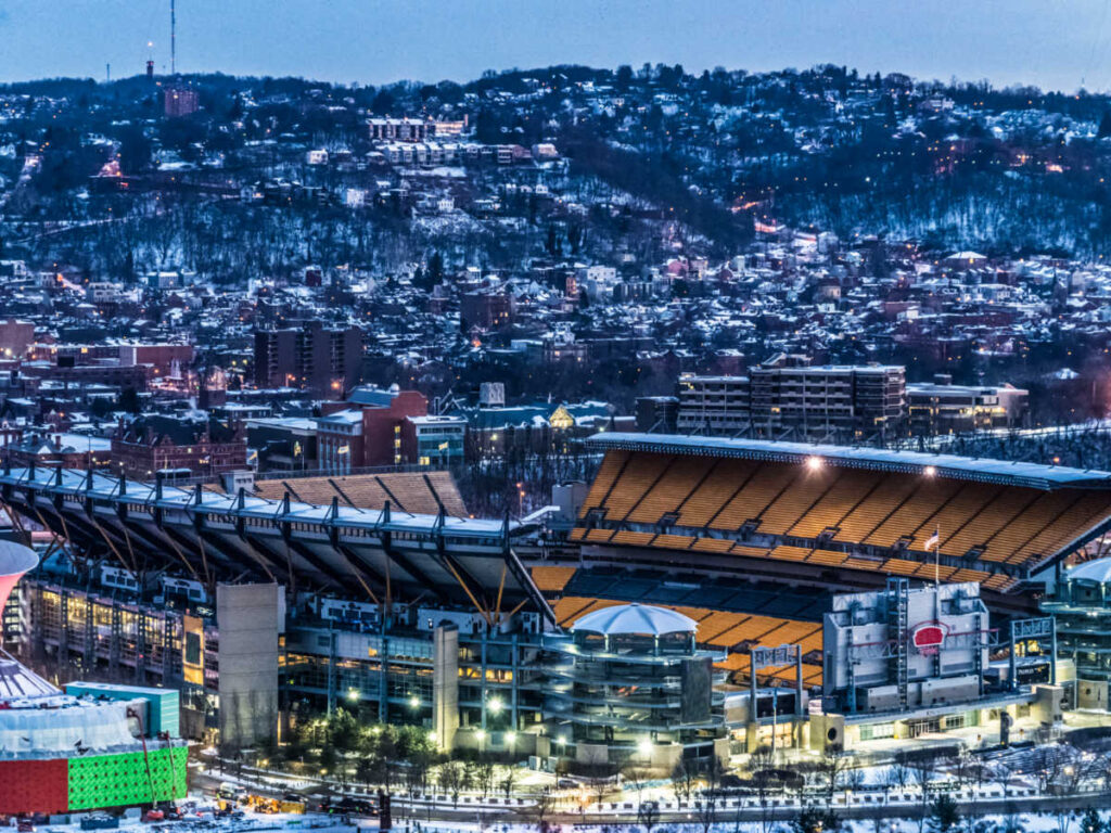 Aerial view of the football stadium surrounded by night lights in Pittsburgh
