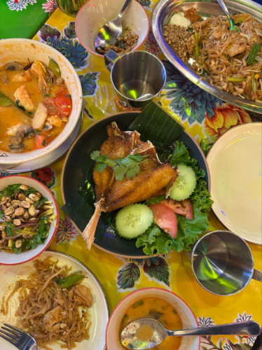 A plate of fried snapper and other dishes in Tuk Tuk Thai