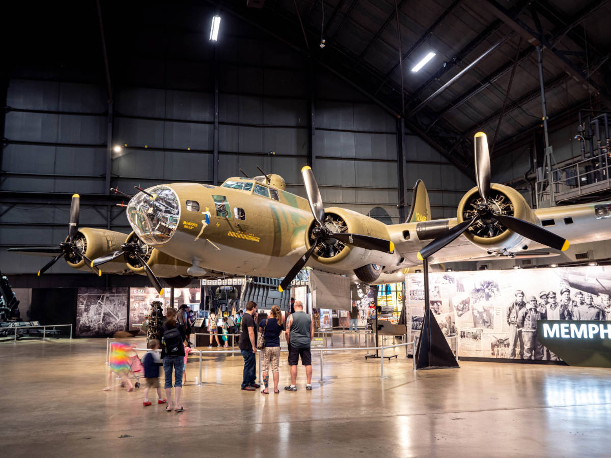 People admiring old planes inside the National Museum of the United States Air Force