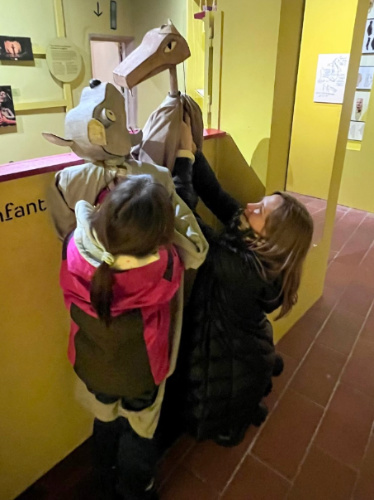 The author, Erin Henk and a girl playing at the Museum of the Art of Puppetry