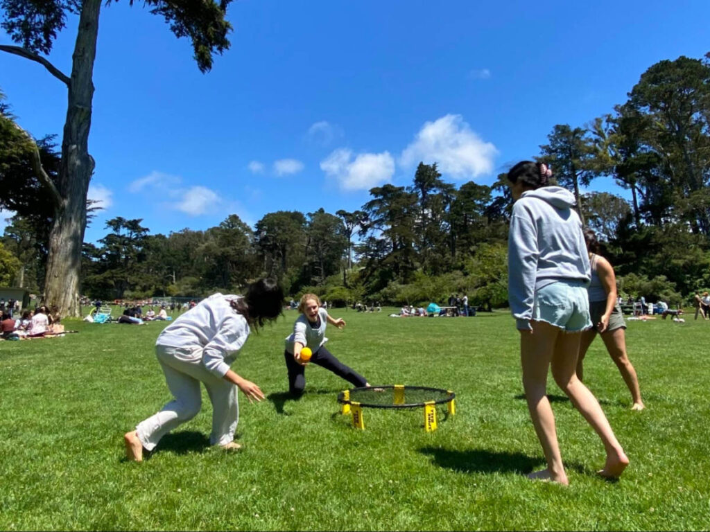 The author Laura McFarland with her friends playing spikeball in Picnic Areas & Meadows