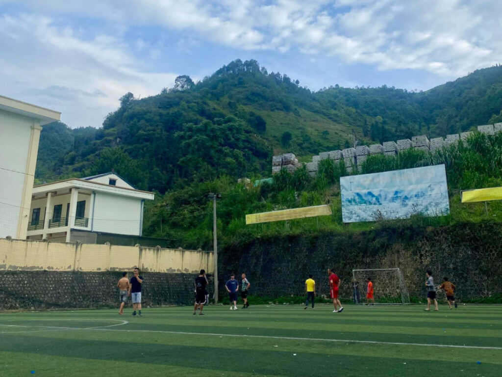 A group playing soccer at a school in Vietnam