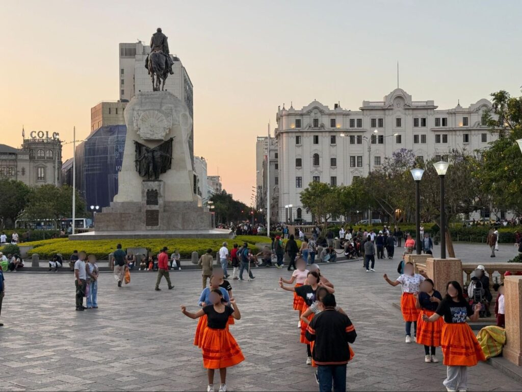 People strolling and dancing at Plaza José de San Martín