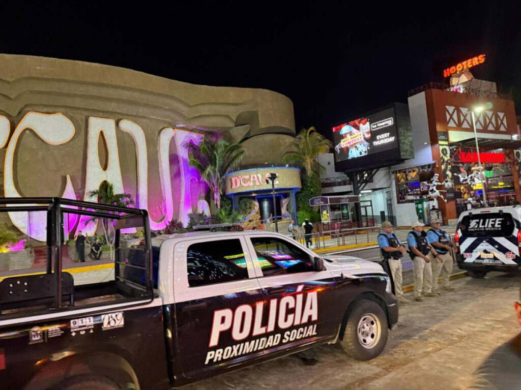A police car with police officers at the Hotel Zone
