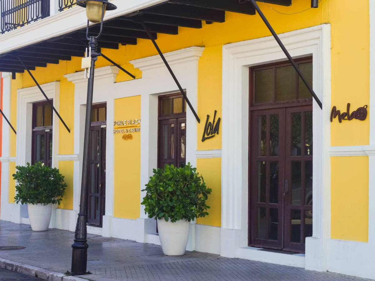 View of the bright yellow exterior of Ponce Plaza Hotel & Casino