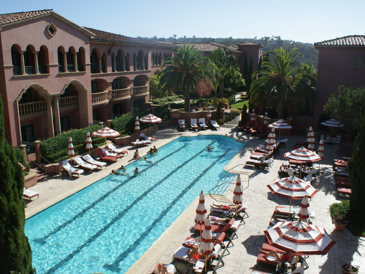 View of people at the pool area in Fairmont Grand Del Mar