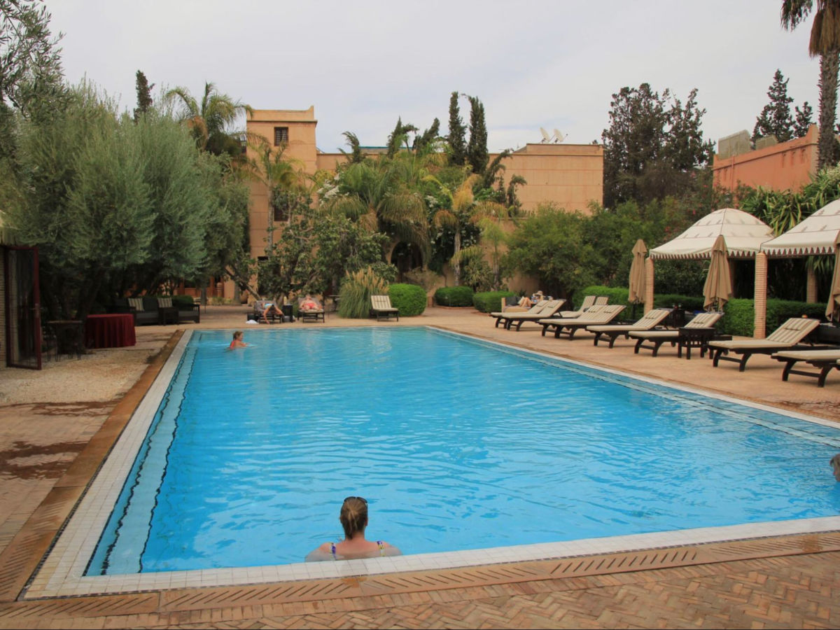 Author Heather enjoying a dip in the the pool at La Maison Arabe