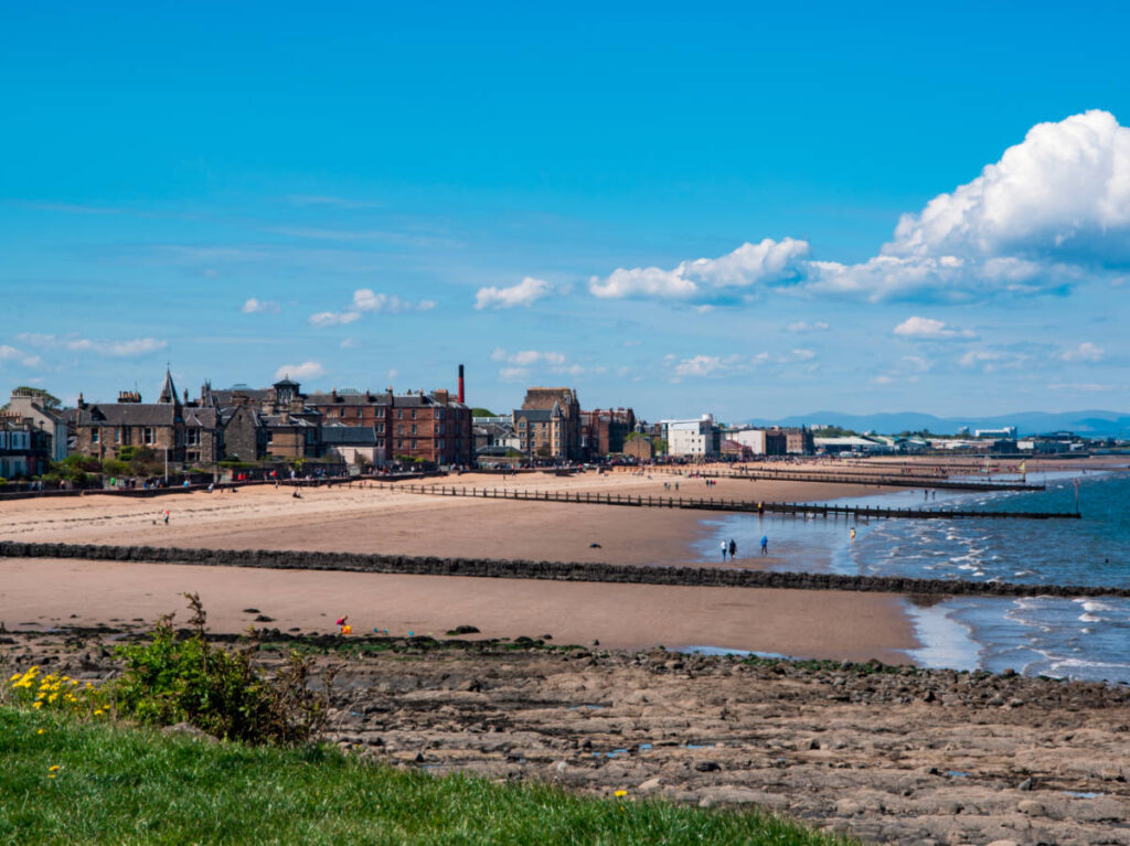 Overlooking view of the buildings along the sandy shoreline of Portobello Beach