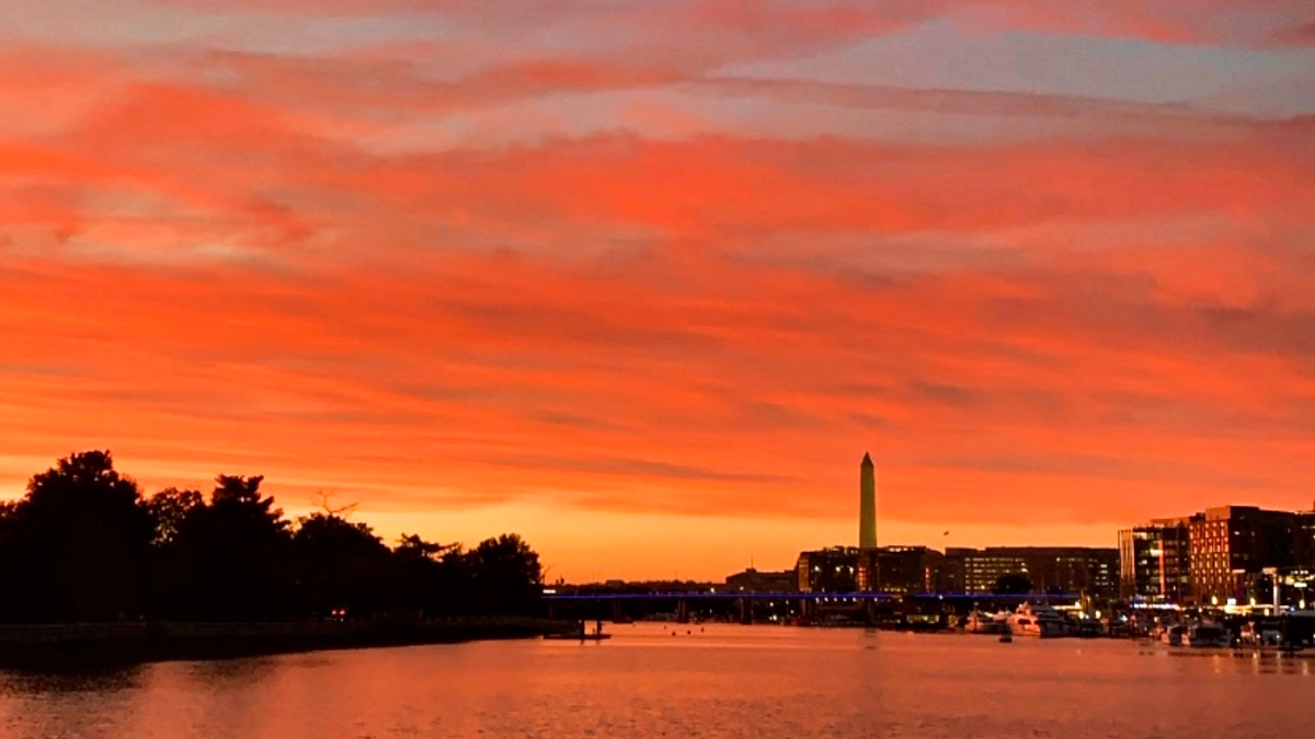 View of the city skyline near the Potomac River at sunset