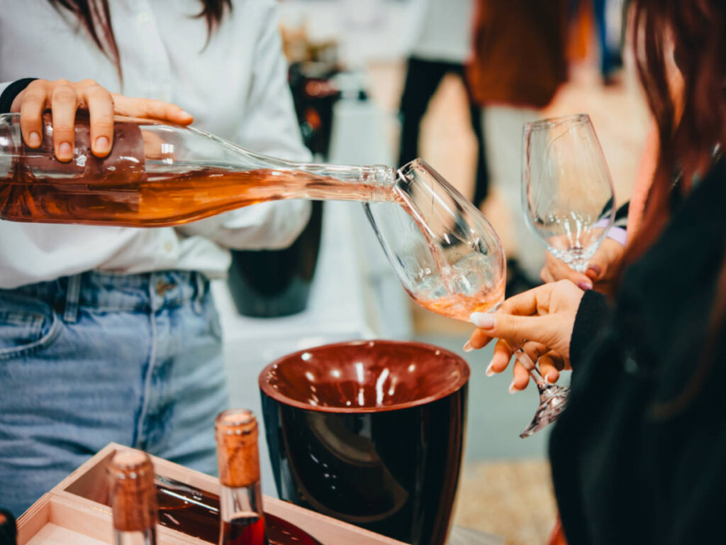 View of a Sommelier pouring wine for wine tasting