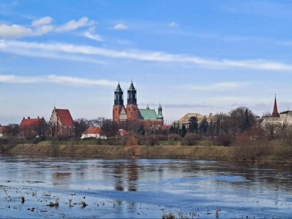 Scenic view of Warta River with the Poznań Cathedral in the background