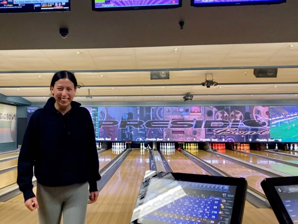 The author's friend smiling for a photo in Presidio Bowl