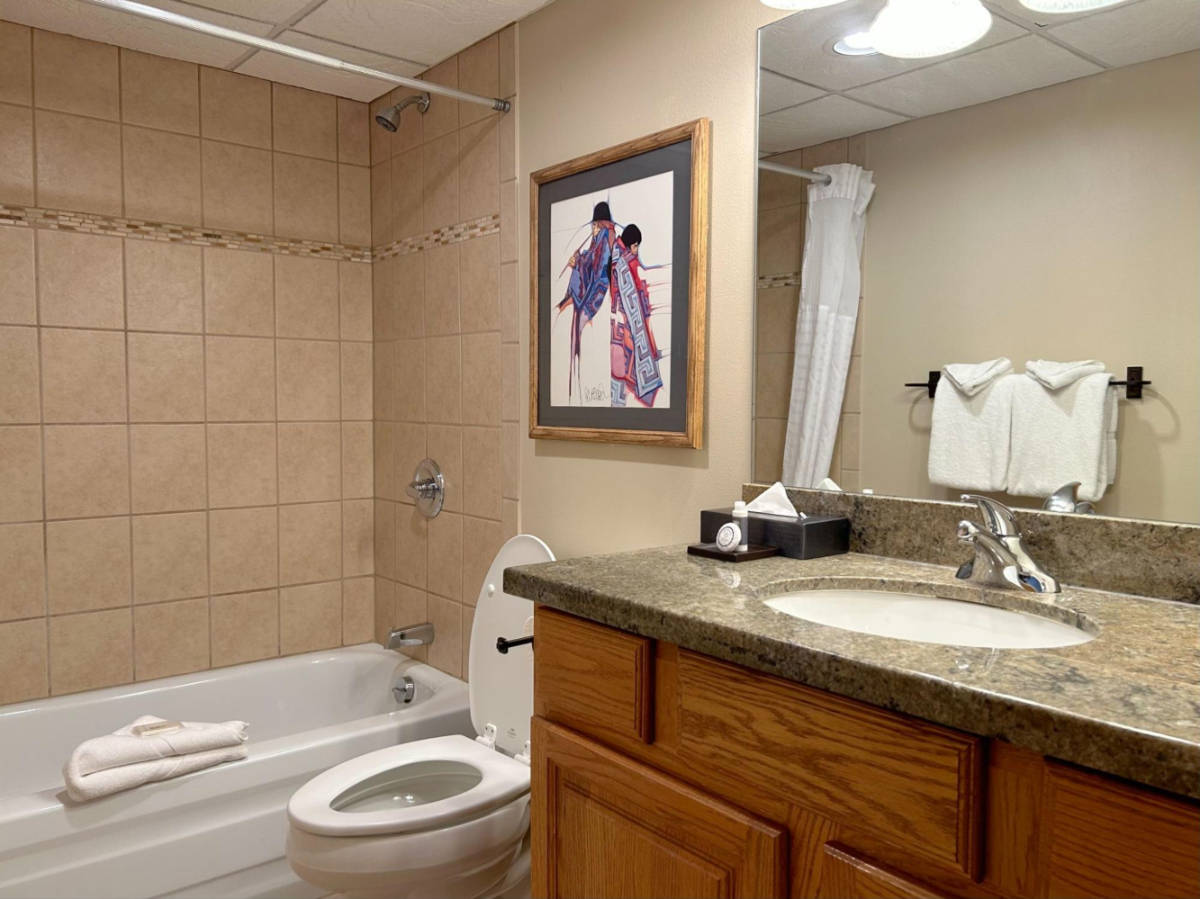 View of the toilet and bath at Beaver Run Resort