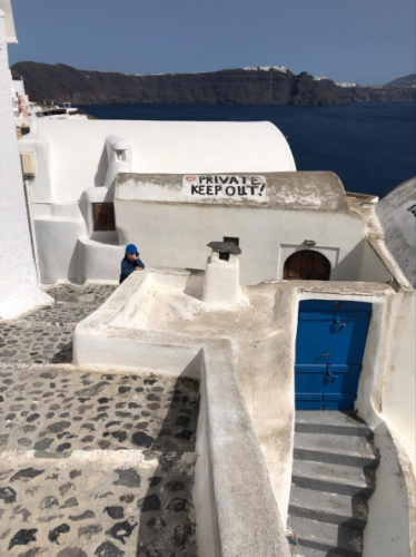 A private property sigange on the roof of the house in Santorini
