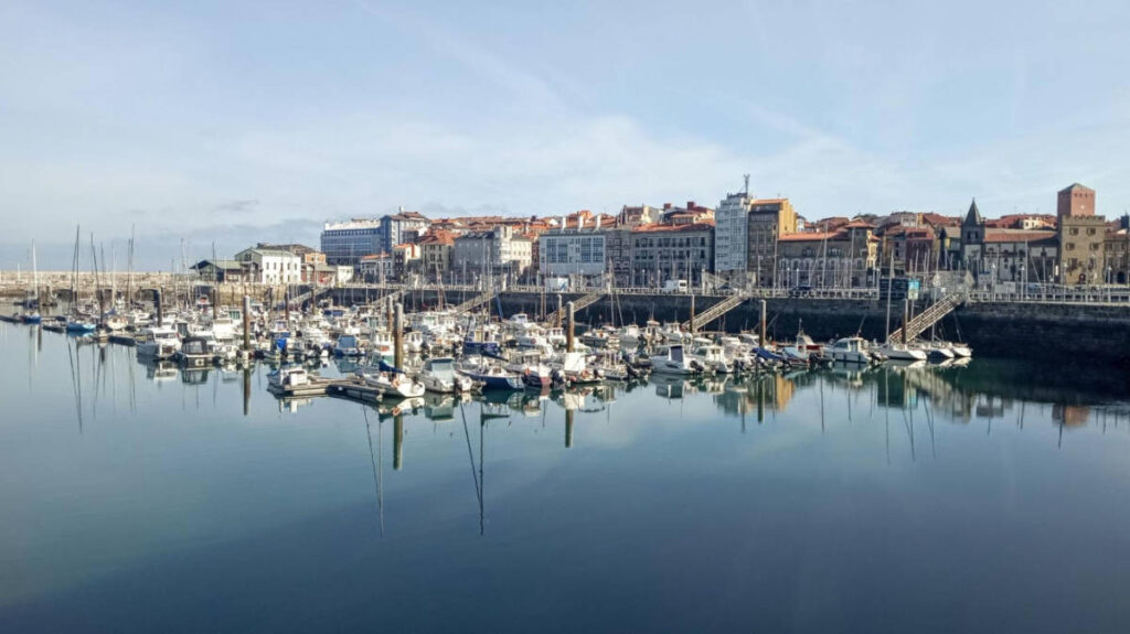 Panoramic view of the boats at the Puerto Deportivo de Gijón and the Old Town