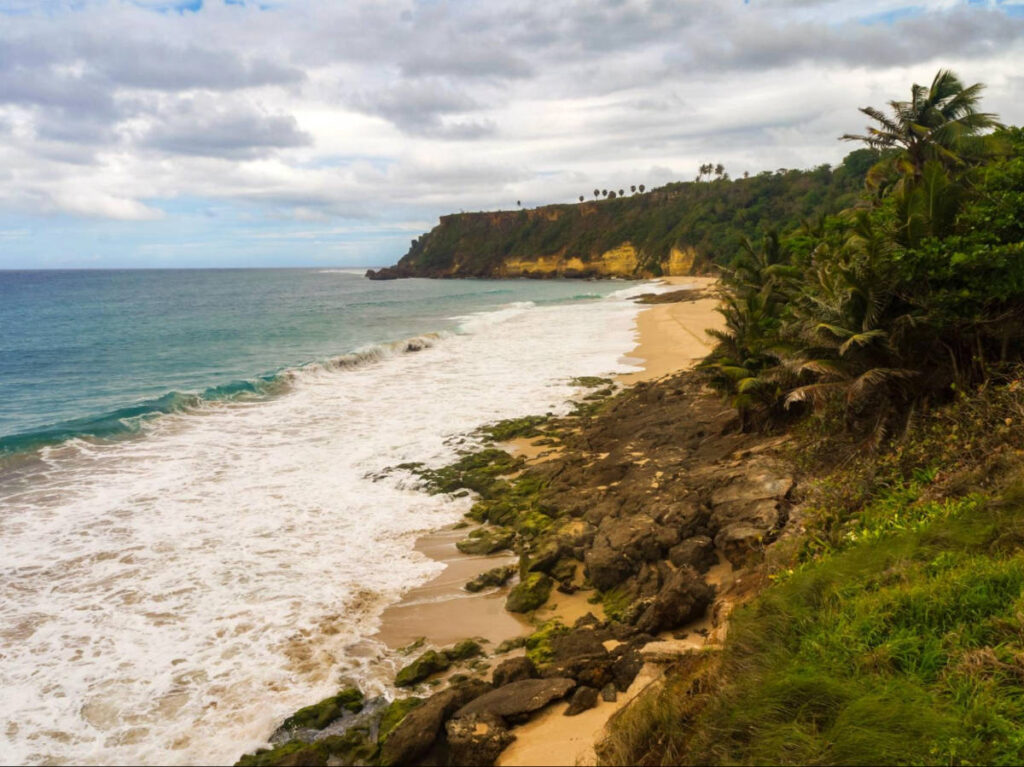 Aerial view of the rock formations creating the cove in Punta Borinquen Beach