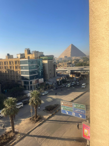 View of the Pyramid of Giza from the rented apartment