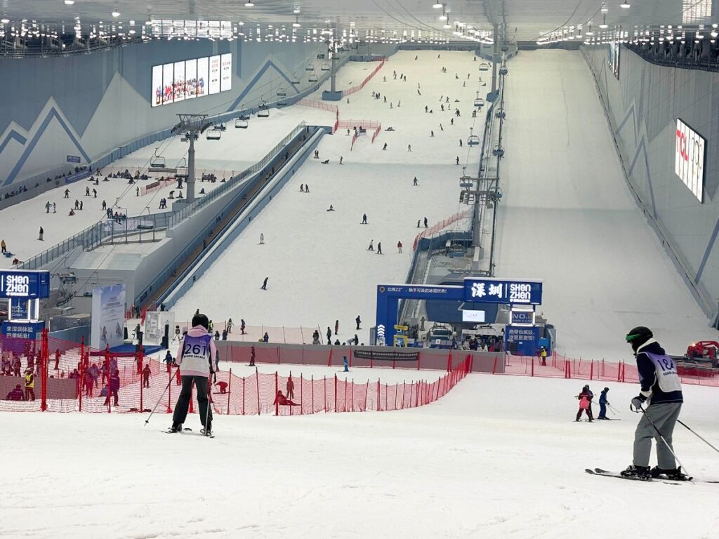 People skiing on the huge indoor Qianhai Ice and Snow World