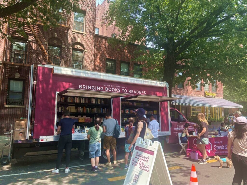 People strolling and shopping at the Queens street fair