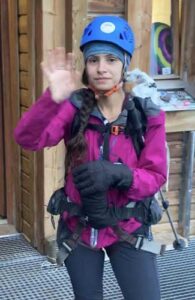 The author wearing her gloves from REI