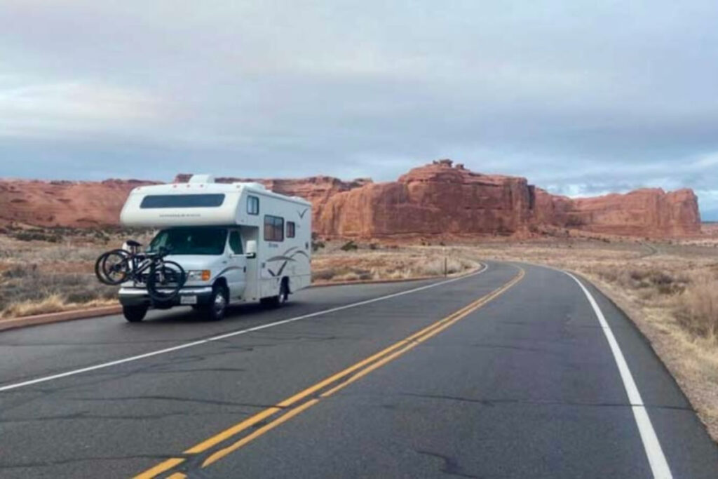 An RV parked on the road outside the campground at Arches