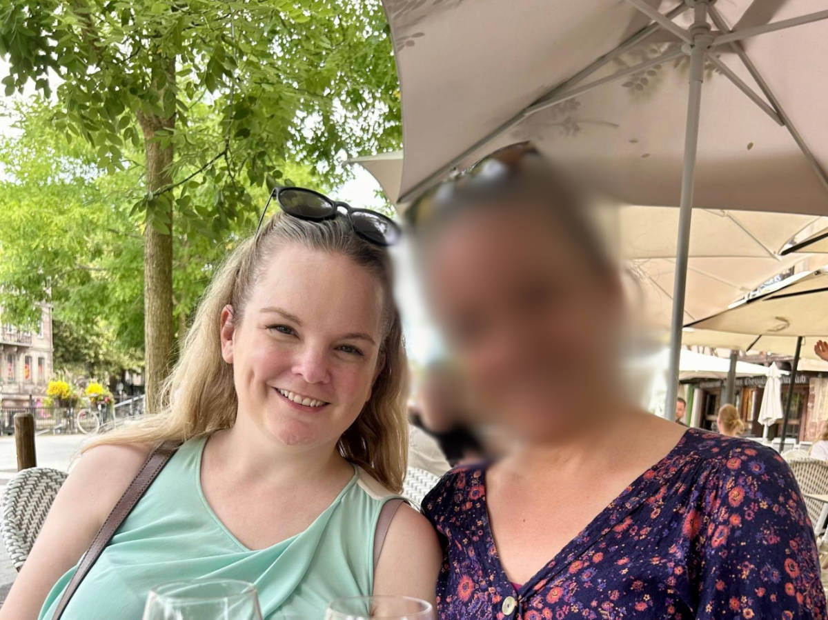 The author Rachel Kapelke-Dale and her sister, sitting at the patio in a Bourse area café
