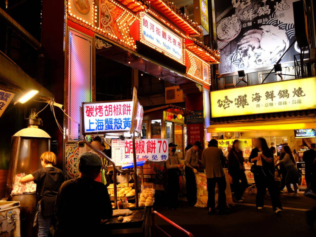 View of people at the entrance of Raohe Street Night Market