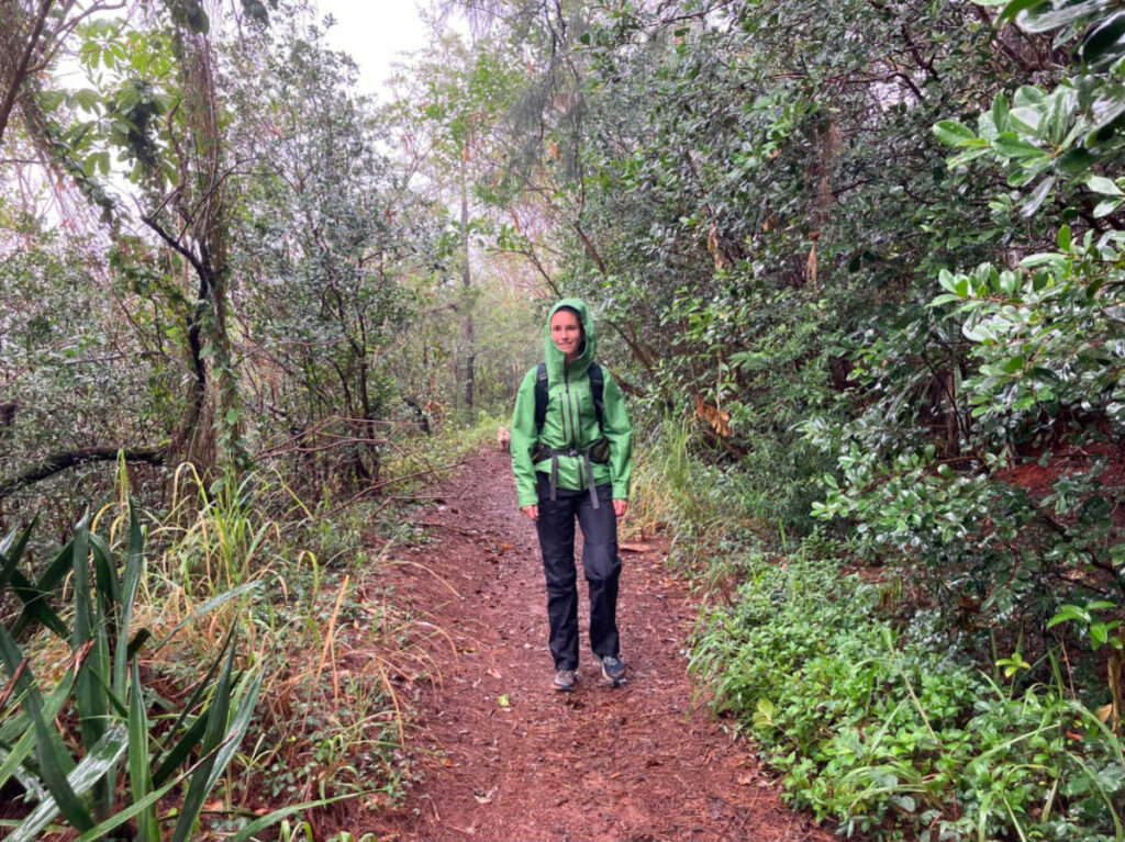 The author Rebecca Parsons hiking in Kaneohe o a rainy day
