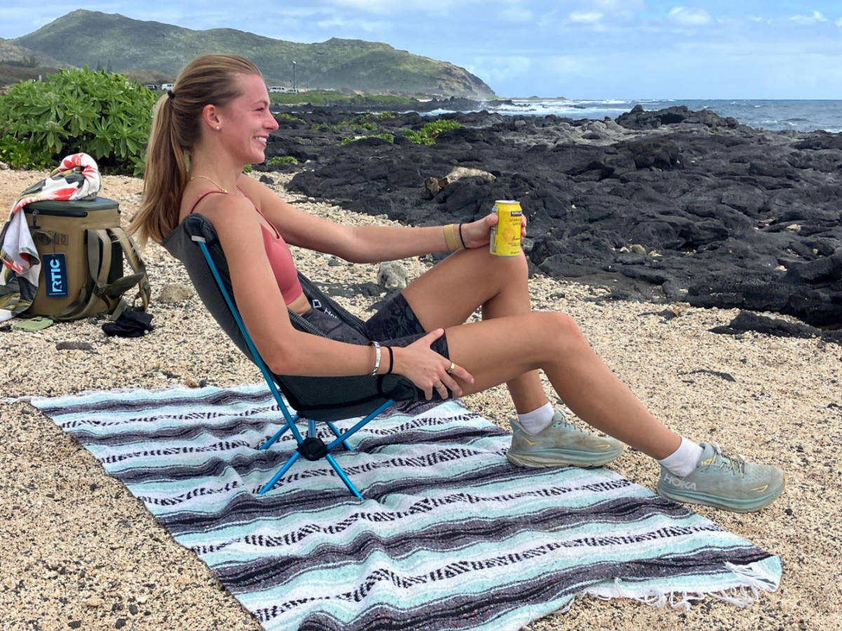 The author Rebecca Parsons sitting on Helinox Chair Zero