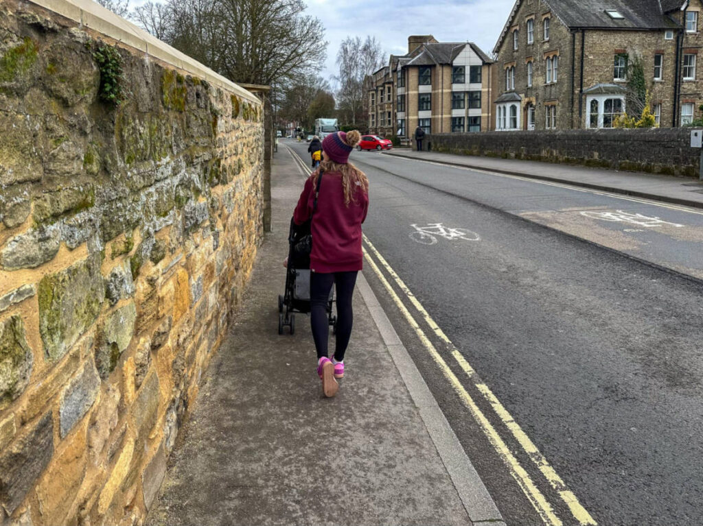 The author Rebecca Rayner, strolling along  the street in Iffley